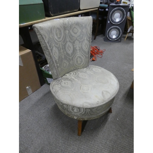 829 - A vintage upholstered bedroom chair.