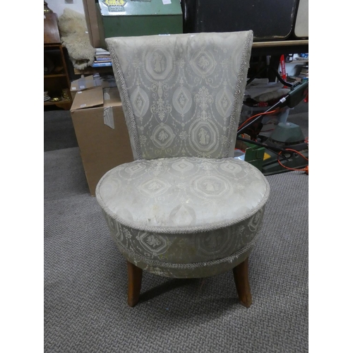 829 - A vintage upholstered bedroom chair.