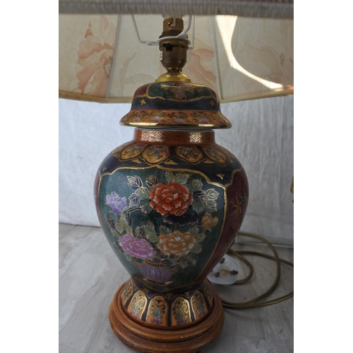 852 - An antique style metal based table lamp and shade with ornate detail.  Approx 60cm.