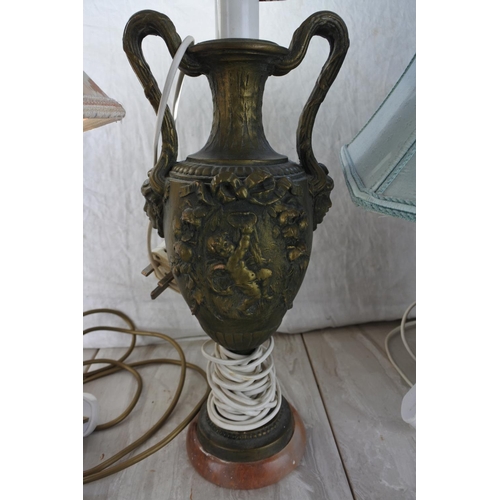 852 - An antique style metal based table lamp and shade with ornate detail.  Approx 60cm.