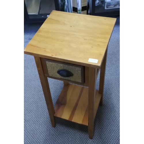 863 - A small pine table with rattan drawer.  Approx 35x76x35cm.