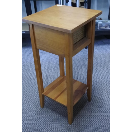 863 - A small pine table with rattan drawer.  Approx 35x76x35cm.