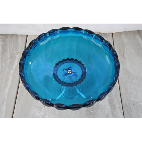 864 - A vintage blue glass serving dish on a silver plated stand.