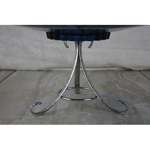 864 - A vintage blue glass serving dish on a silver plated stand.