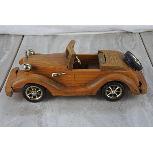 884 - A wooden model/ toy car.