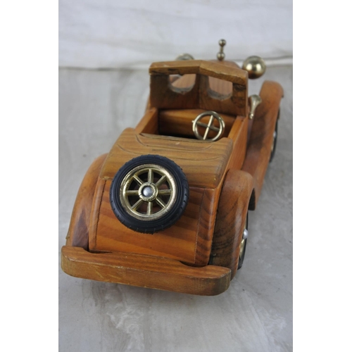 884 - A wooden model/ toy car.