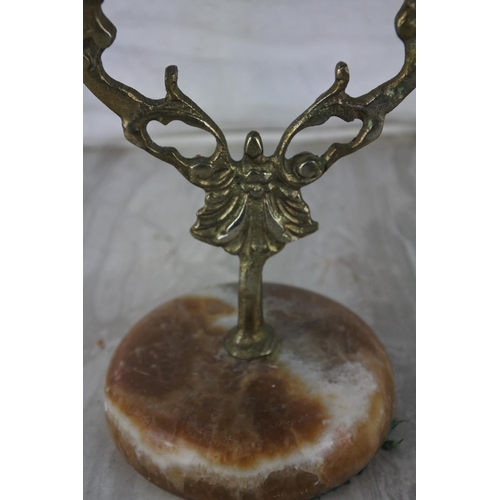 894 - A marble based two branch candlestick.