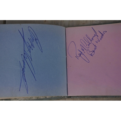 896 - A vintage autograph album with motor sport interest, containing autographs such as Robert Dunlop, St... 