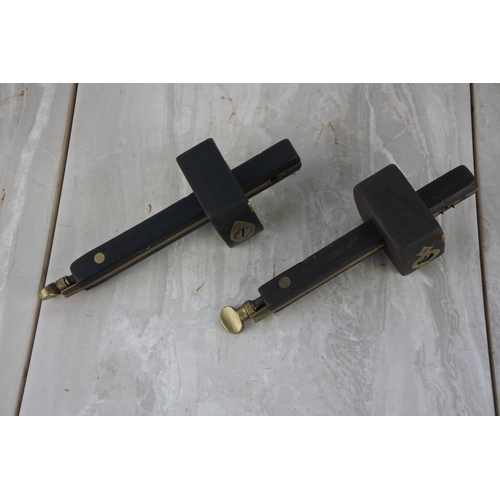 897 - Two antique wood and brass carpenter scribes.