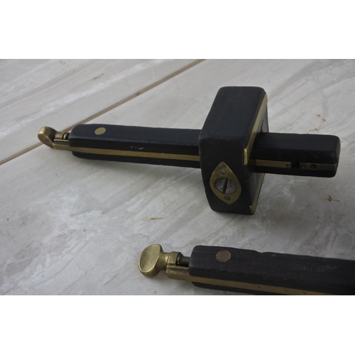 897 - Two antique wood and brass carpenter scribes.