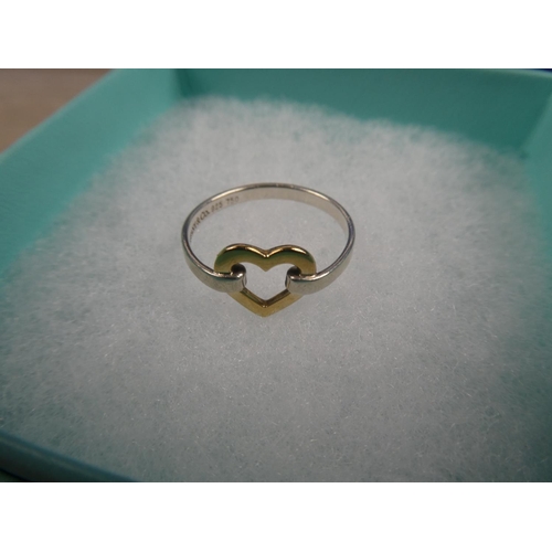 1004 - A stunning Tiffany & Co sterling silver and 18ct gold open heart dress ring in presentation box,