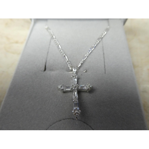 910 - A sterling silver chain and cubic zirconia cross pendant.