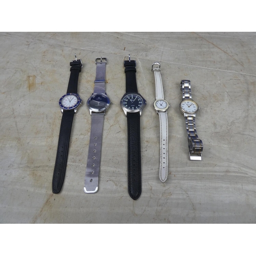 919 - Five working wrist watches to include Geneve, copy Calvin Klein and more.