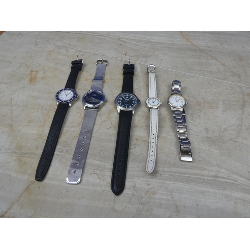 919 - Five working wrist watches to include Geneve, copy Calvin Klein and more.