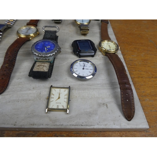 945 - A large lot of assorted watches for parts and repair.