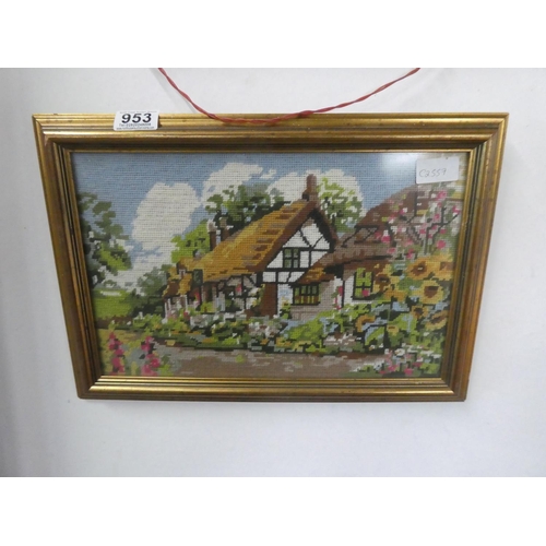 953 - A framed tapestry of a cottage scene.  Approx 42x29cm.