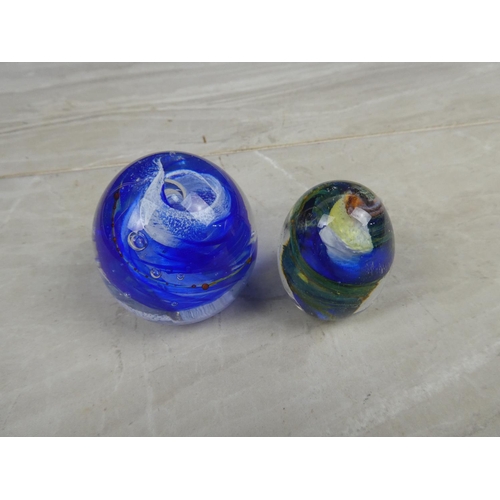 973 - A pair of art glass paperweights.