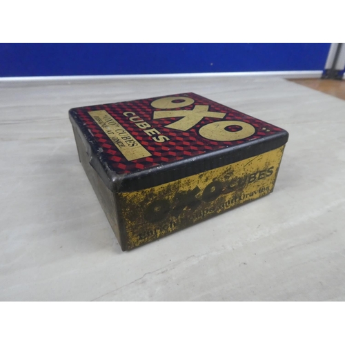 975 - A vintage OXO tin and a lot of vintage train patterned dominoes.