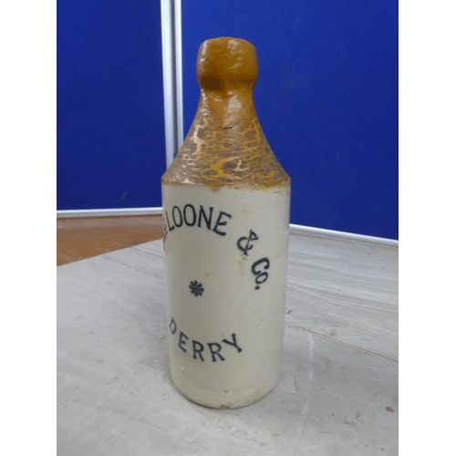 996 - An antique N McLoone & Co, Derry stoneware beer bottle with repair.