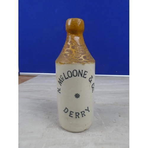 996 - An antique N McLoone & Co, Derry stoneware beer bottle with repair.