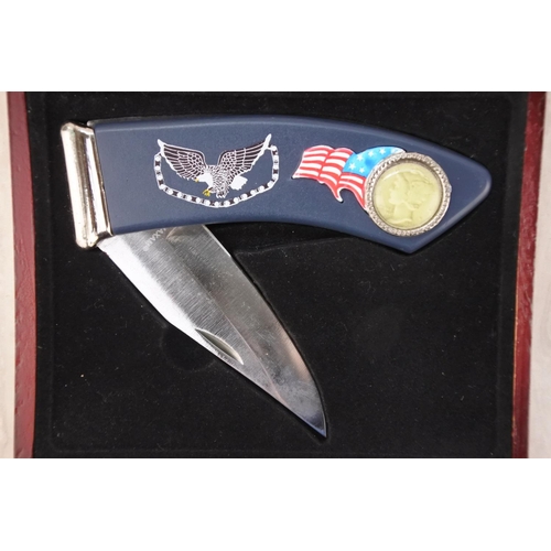 1006 - A cased Maxam American themed penknife.