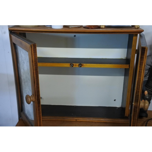 1015 - A small pine two door cabinet with mirror doors.  Approx 46x56x14cm.