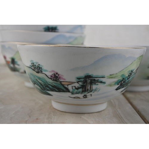 1018 - A set of six oriental patterned soup bowls and spoons.