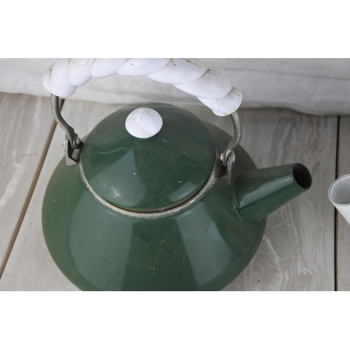 1022 - Two enamel teapots.