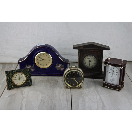 1026 - A stunning vintage Europa mantle clock with koha paua shell and four other clocks.