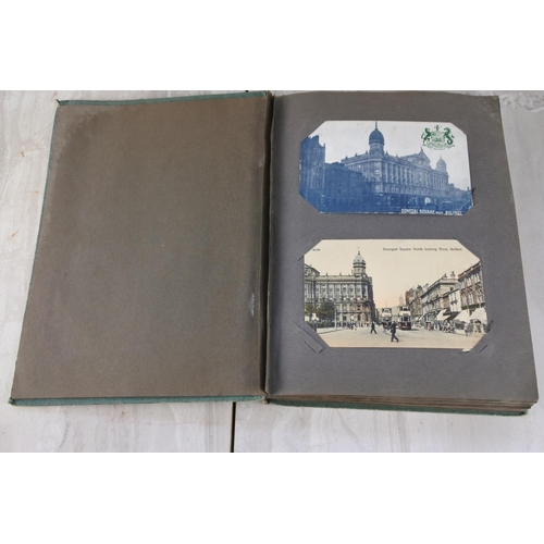 1028 - A vintage postcard album containing postcards from Belfast, Giant's Causeway, Dublin, comical postca... 