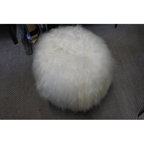 1038 - A stunning sheepskin covered stool.