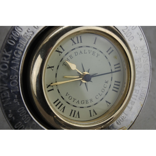 1053 - A cased Dalvey Voyager clock.