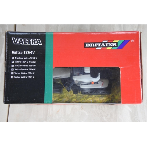 1061 - A boxed Britains Valtra TZ54V tractor, scale 1:32.