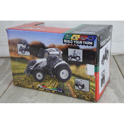 1061 - A boxed Britains Valtra TZ54V tractor, scale 1:32.