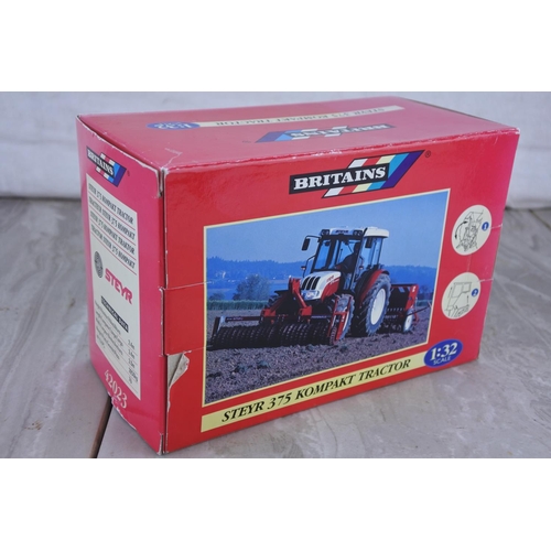 1063 - A boxed Britains Steyr 375 Kompakt tractor, scale 1:32.