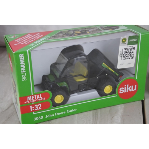 1064 - A boxed Siku 3068 Aebi TerraTrac TT211, a boxed Siku 3060 John Deere Gator and a boxed Vicon Pendulu... 