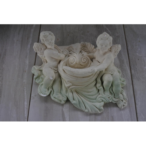 1083 - A plaster wall plaque of cherubs.