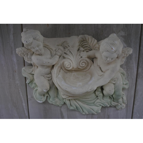 1083 - A plaster wall plaque of cherubs.