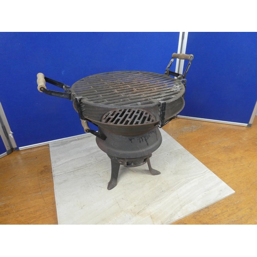 627 - A portable cast iron barbecue.