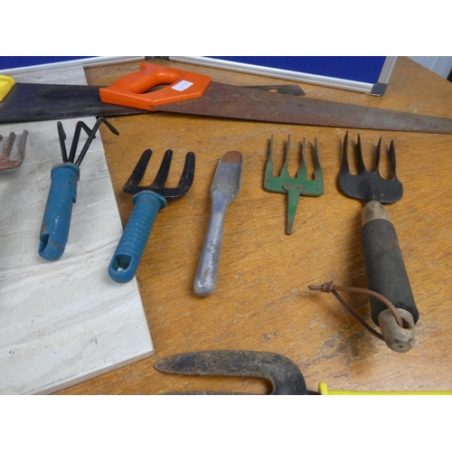 631 - Three handsaws, gardening tools and more.