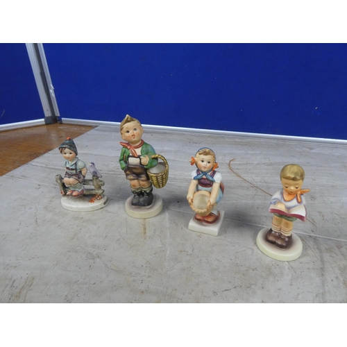 659 - Four Hummel figures Little Helper, Honor Student, Village Boy and another Wayside Harmony (a/f).