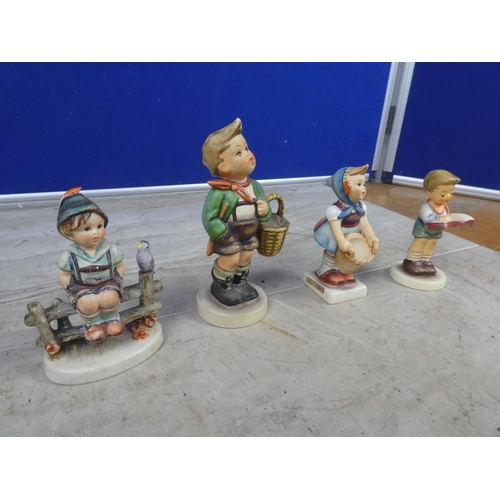 659 - Four Hummel figures Little Helper, Honor Student, Village Boy and another Wayside Harmony (a/f).