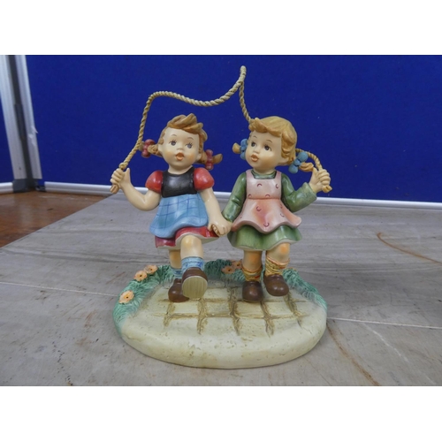 667 - Two Hummel figurines 'All in Together' and 'Christmas Fun'.