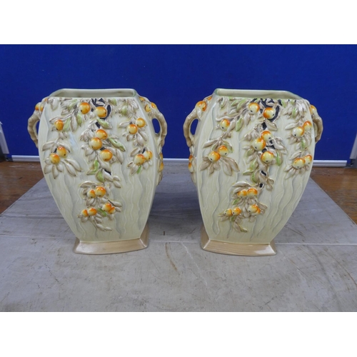 673 - A pair of stunning art deco Myott & Son hand painted vases decorated with fruit.  Approx 21cm.