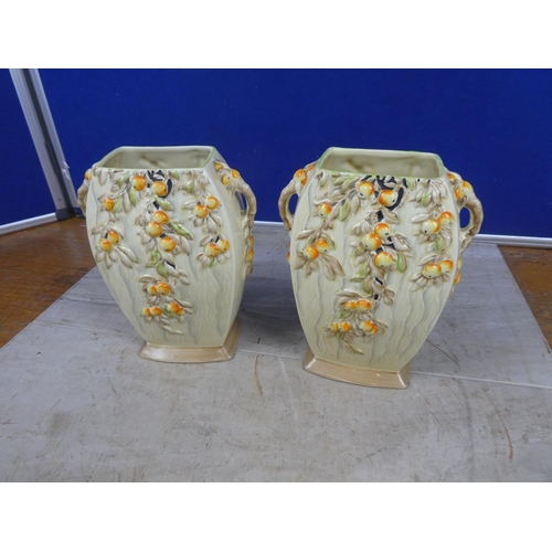 673 - A pair of stunning art deco Myott & Son hand painted vases decorated with fruit.  Approx 21cm.