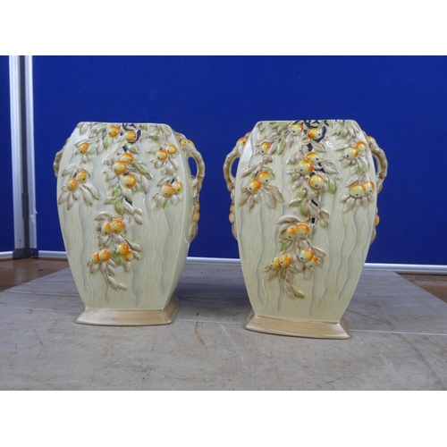 673 - A pair of stunning art deco Myott & Son hand painted vases decorated with fruit.  Approx 21cm.