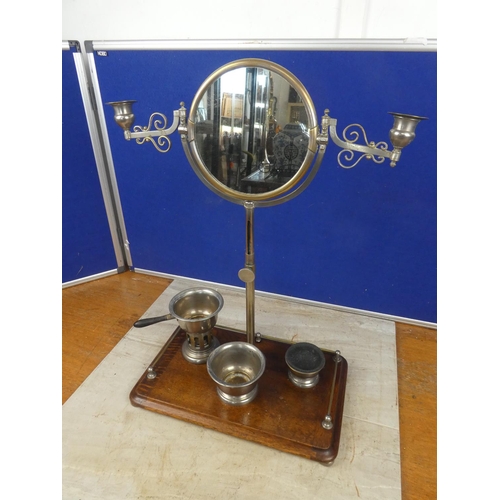 679 - A Campaign shaving mirror on an oak stand.  Approx 38x53x23cm.