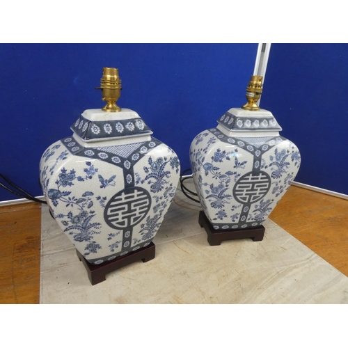 680 - A stunning pair of blue and white Chinese themed ceramic table lamp bases.  Approx 40cm.