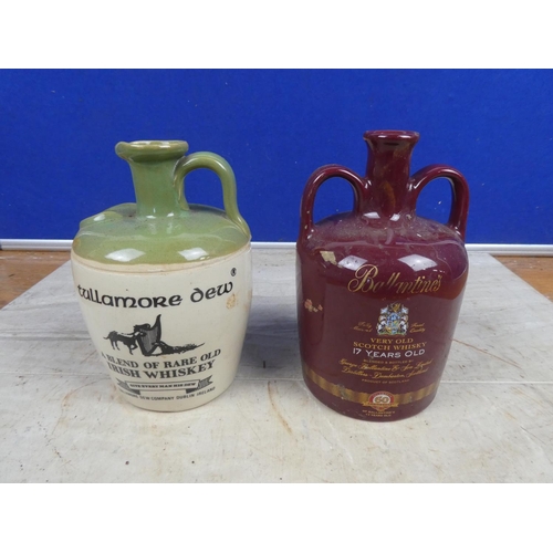 686 - A 'Tullamore Dew' stoneware whiskey flagon and a Wade 'Ballentines' ceramic whiskey flagon.