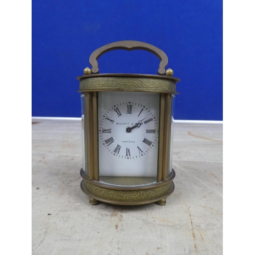 690 - A stunning miniature Ellliott & Son, London carriage clock, with decorative brass case and ceramic f... 